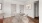 a dining room with white chairs and easy access to other areas