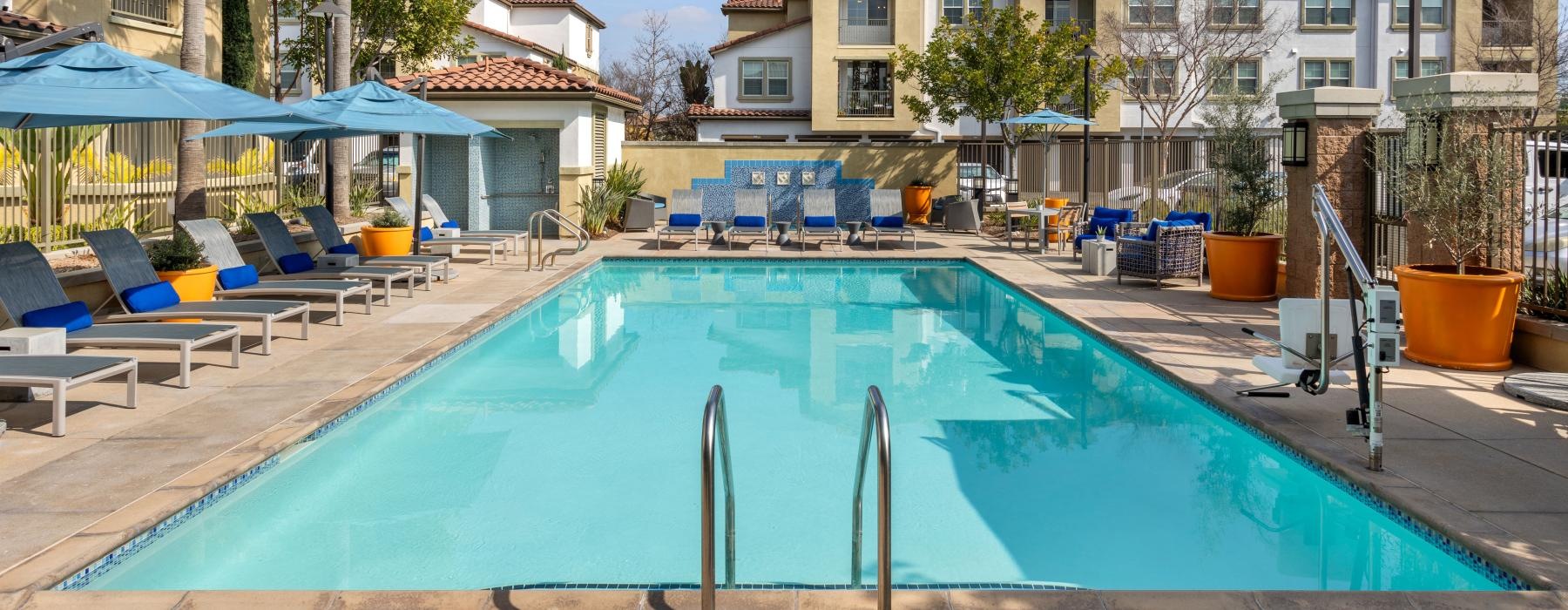 wide pool with reclining seats and nearness to property