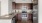 a kitchen with wooden cabinets