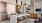 a kitchen with a bar stool and a table