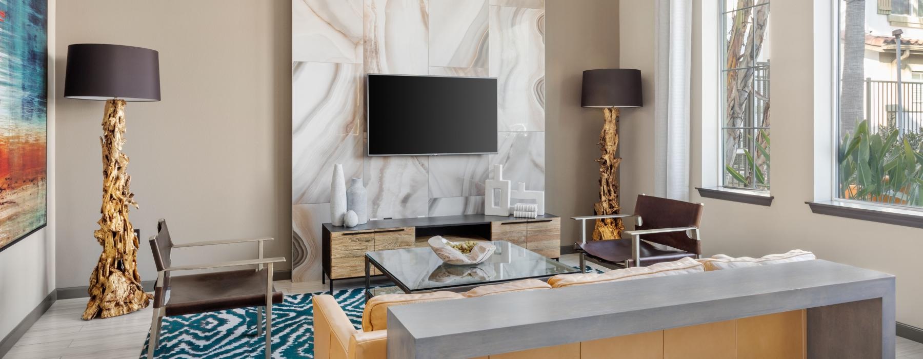 lounge area with modern decor, a TV and seating