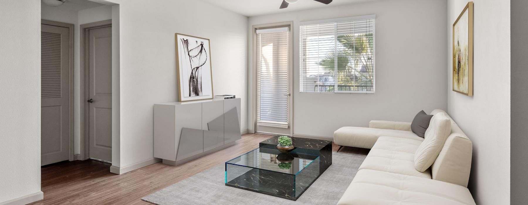a living room with a white couch and a coffee table